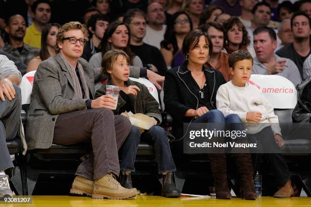 Simon Baker, Claude Blue, Rebecca Rigg and Harry Friday attend a game between the Houston Rockets and the Los Angeles Lakers at Staples Center on...