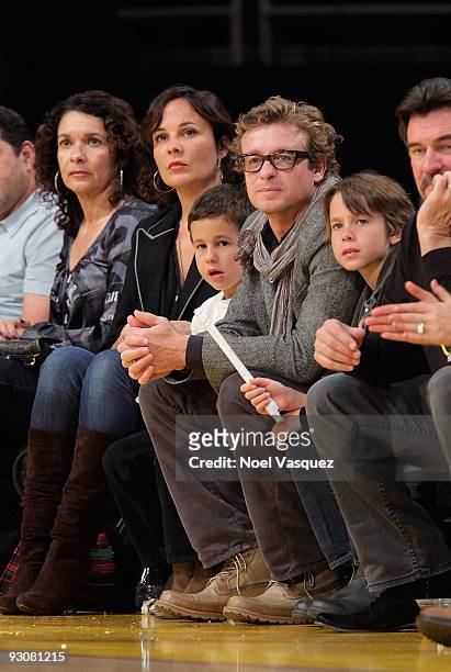 Rebecca Rigg, Harry Friday, Simon Baker and Claude Blue attend a game between the Houston Rockets and the Los Angeles Lakers at Staples Center on...