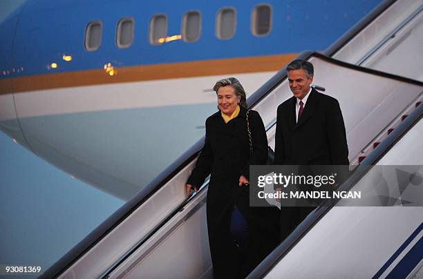 Secretary of State Hillary Clinton and US ambassador to China Jon Huntsman, step off Air Force One November 16, 2009 upon arrival at Capital...