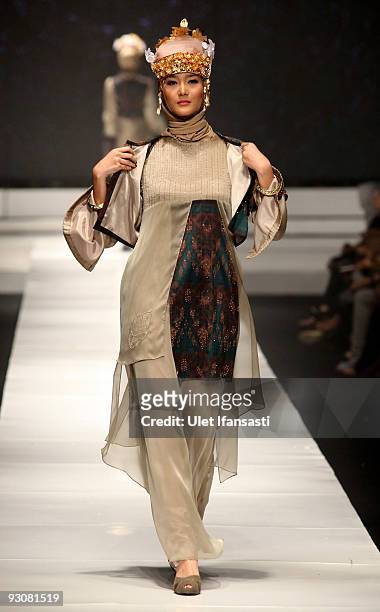 Model showcases designs on the runway by Nieta Hidayani as part of APPMI Show 1 on day three of Jakarta Fashion Week 2009 at the Fashion Tent,...