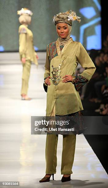 Model showcases designs on the runway by Nieta Hidayani as part of APPMI Show 1 on day three of Jakarta Fashion Week 2009 at the Fashion Tent,...