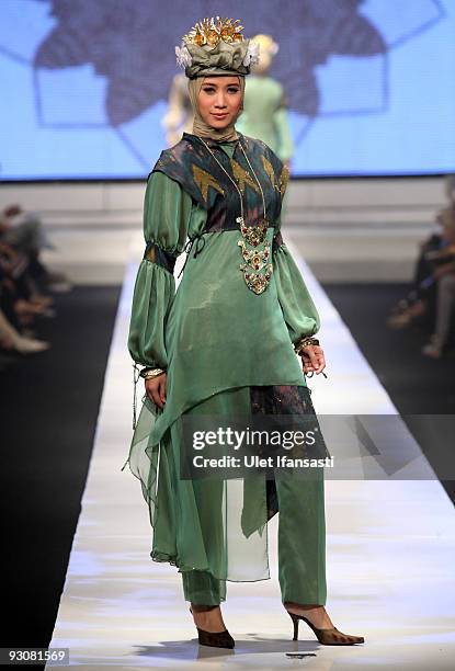 Model showcases designs on the runway by Nieta Hidayani as part of APPMI Show 1 on day three of Jakarta Fashion Week 2009 at the Fashion Tent,...