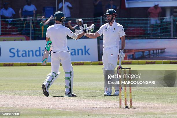 South Africa batsman Theunis de Bruyn and Proteas captain Faf du Plessis shake hands after winning during day four of the second Cricket Test match...