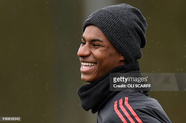 Manchester United's English striker Marcus Rashford attends a team training session at the club's training complex near Carrington, west of...