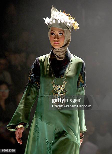 Model showcases designs on the runway by Nieta Hidayani as part of APPMI Show 1 on day three of Jakarta Fashion Week 2009 at the Fashion Tent,...