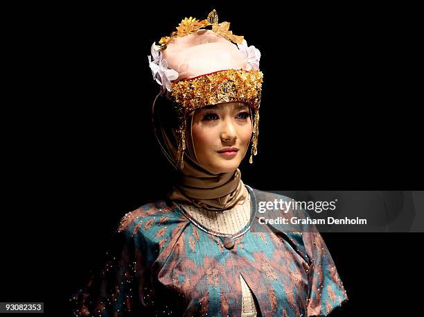 Model showcases designs on the runway by Nieta Hidayani as part of APPMI Show 1 on day three of Jakarta Fashion Week 2009 at the Fashion Tent,...