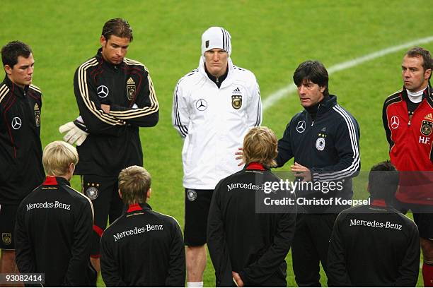 Marcel Schaefer, Tim Wiese, Bastian Schweinsteiger, national coach Joachim Loew and assistant coach Hansi Flick come together during a German...