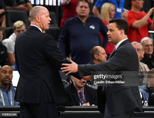 Head coach Tad Boyle of the Colorado Buffaloes and head coach Sean Miller of the Arizona Wildcats shake hands after the Wildcats defeated the...