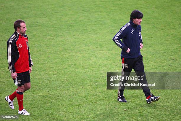 Assistant coach Hansi Flick and National coach Joachim Loew looks thoughtful during a German national team training session at the Esprit Arena on...