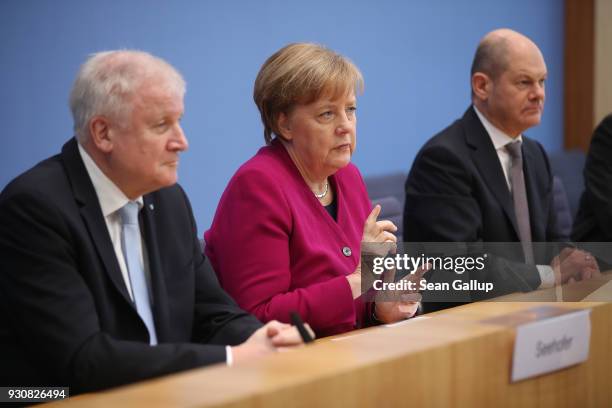 German Chancellor and Chairwoman of the German Christian Democrats Angela Merkel , Acting Chairman of the German Social Democrats Olaf Scholz and...