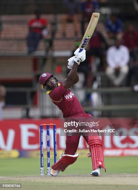 Rovman Powell of The West Indies scores runs during The ICC Cricket World Cup Qualifier between The West Indies and The Netherlands at The Harare...