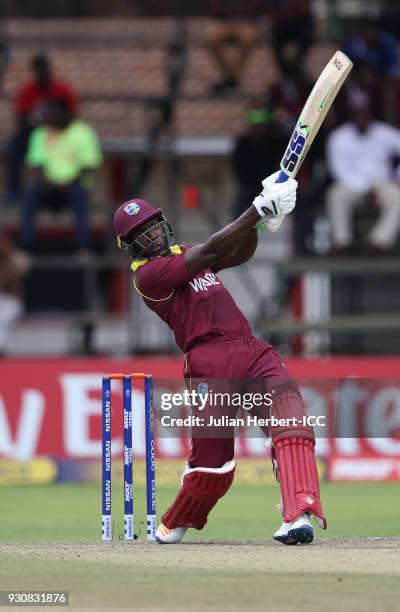 Rovman Powell of The West Indies scores runs during The ICC Cricket World Cup Qualifier between The West Indies and The Netherlands at The Harare...