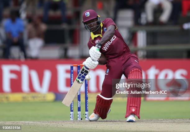 Rovman Powell of The West Indies scores runs during The ICC Cricket World Cup Qualifier between The West Indies and The Netherlands at The Harare...