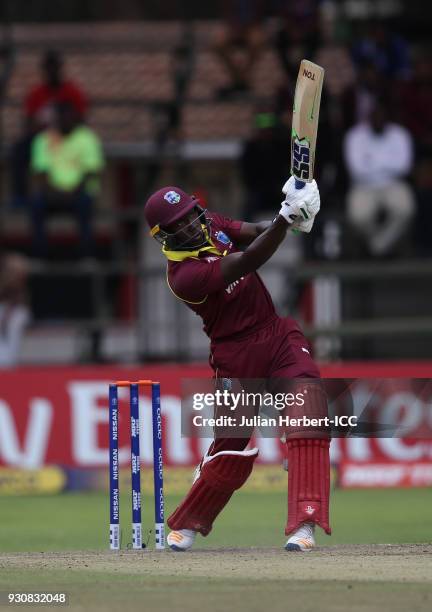 Rovman Powell of The West Indies scores runs during The ICC Cricket World Cup Qualifier between The West Indies and The Netherlands at The Harare...