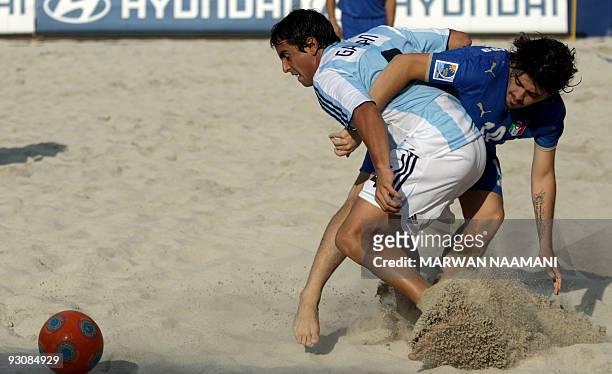 Matias Galvan of Argentina vies for the ball against Diego Maradona Jr of Italy during their match on November 16 the first day of the FIFA Beach...