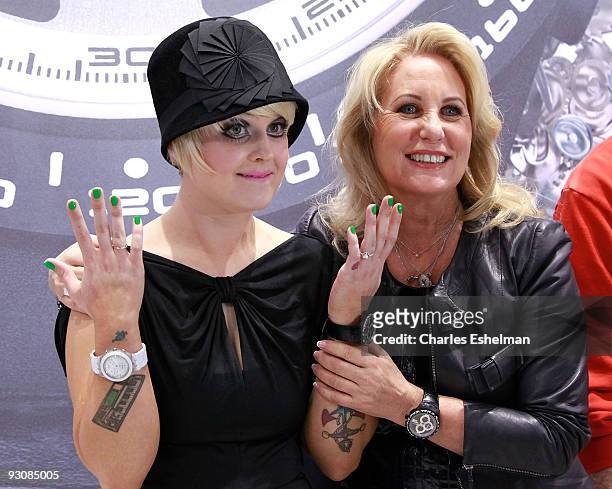 Dancing with the Stars' Kelly Osbourne and Swatch Worldwide President, Madame Emch attend the Swatch Brand re-launch at the Swatch Store Times Square...