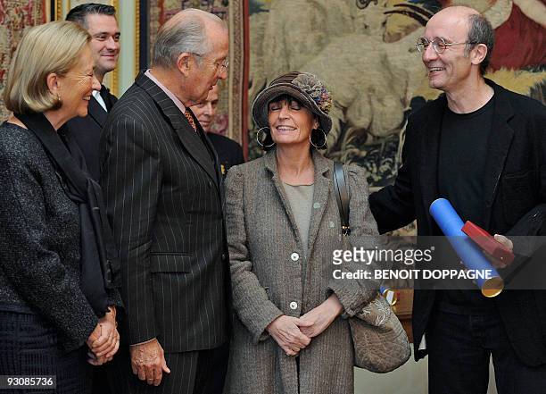 Queen Paola and King Albert II of Belgium congratulate cartoonist Philippe Geluck , father of "Le Chat" and his wife Dany on November 16 during a...