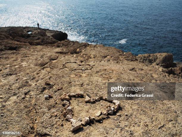 Man Stacking Rocks Man Stacking Rocks Photos and Premium High Res Pictures - Getty Images