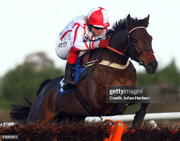 Robert Thornton and The Betchworth Kid clear an early flight in company before going on to win The Ladbrokes Bamiyan Novices' Hurdle Race run at...