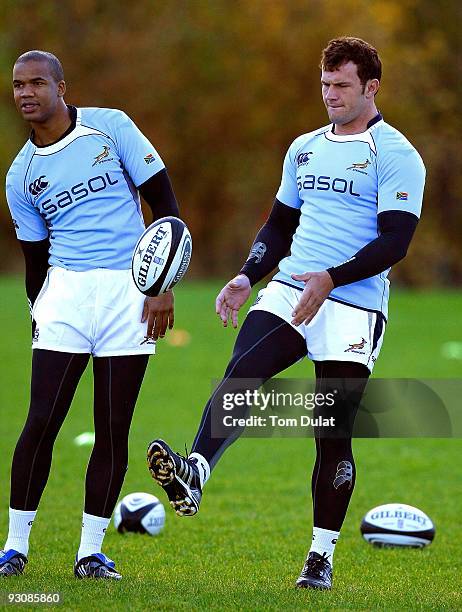 Pietersen and Bismarck du Plessis take part in the South Africa training session at Old Albanians Rugby Club on November 16, 2009 in St Albans,...