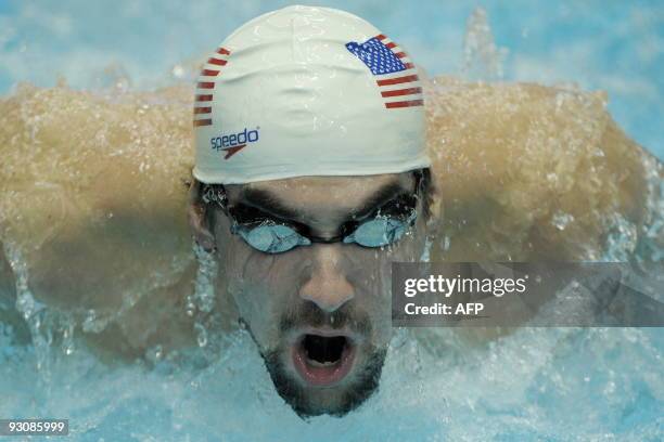 Michael Phelps of the US competes in the heats of the Men's 200m Butterfly at the FINA/ARENA Swimming World Cup 2009 in Berlin November 14, 2009. AFP...