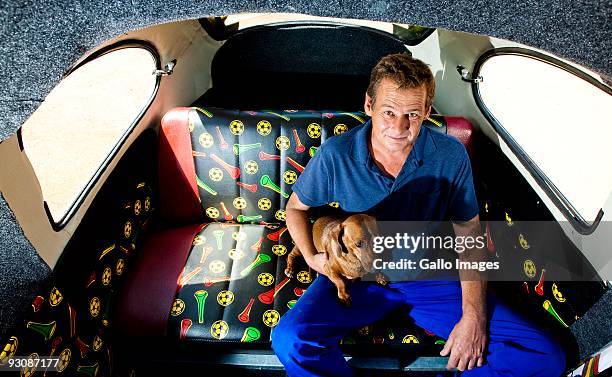Wynand Viljoen sits inside his football-themed Volkswagen Beetle he created to show his support for Bafana Bafana on November 13, 2009 in Pretoria,...