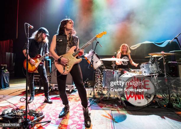 Graham Whitford, Tyler Bryant and Caleb Crosby of Tyler Bryant & The Shakedown perform at The Fillmore on March 10, 2018 in Detroit, Michigan.