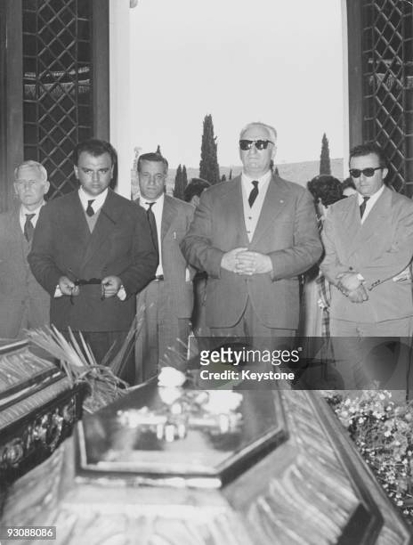 Italian race car driver and businessman Enzo Ferrari attends the funeral of Spanish racing driver Alfonso de Portago, 14th May 1957. De Portago was...