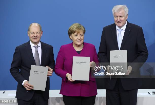 German Chancellor and Chairwoman of the German Christian Democrats Angela Merkel , Acting Chairman of the German Social Democrats Olaf Scholz and...