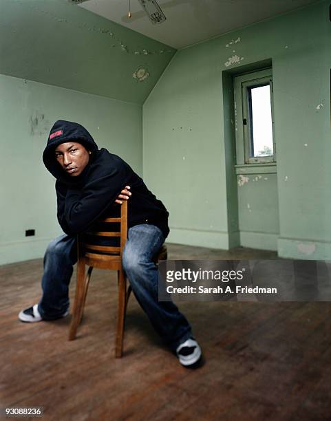 Singer Pharrell Williams poses for a portrait session in 2003 for One World Magazine.