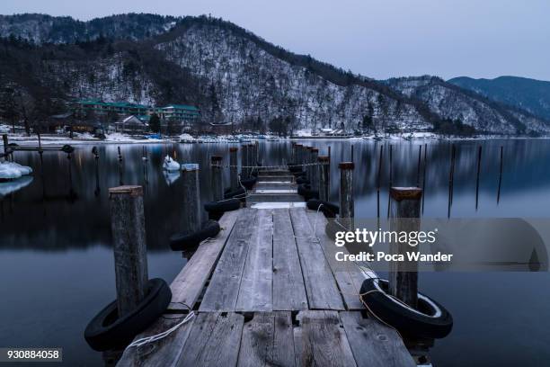 nikko city view of lake chuzenji with pier - nikko city stockfoto's en -beelden