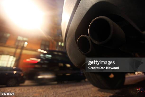 An exhaust pipe sticks out the rear of a car parked on a street on November 16, 2009 in London, England. As world leaders prepare to gather for the...