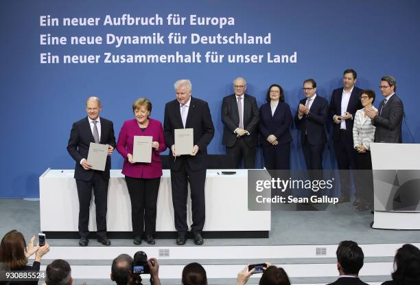 German Chancellor and Chairwoman of the German Christian Democrats Angela Merkel , Acting Chairman of the German Social Democrats Olaf Scholz and...