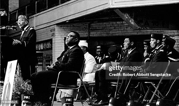 Nation of Islam leader Elijah Muhammad speaks from a lecturn during Saviour's Day celebrations at the International Ampitheatre, Chicago, Illinois,...