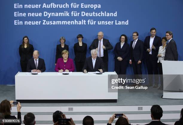 German Chancellor and Chairwoman of the German Christian Democrats Angela Merkel , Acting Chairman of the German Social Democrats Olaf Scholz and...