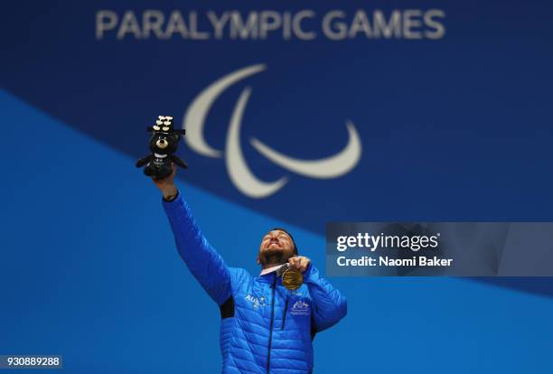 Gold Medalist Simon Patmore of Australia celebrates during the medal ceremony for the Men's Snowboard Cross SB-UL during day three of the PyeongChang...