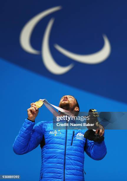 Gold Medalist Simon Patmore of Australia celebrates during the medal ceremony for the Men's Snowboard Cross SB-UL during day three of the PyeongChang...