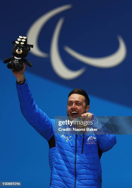 Gold Medalist Simon Patmore of Australia celebrates during the medal ceremony for the Men's Snowboard Cross SB-UL during day three of the PyeongChang...