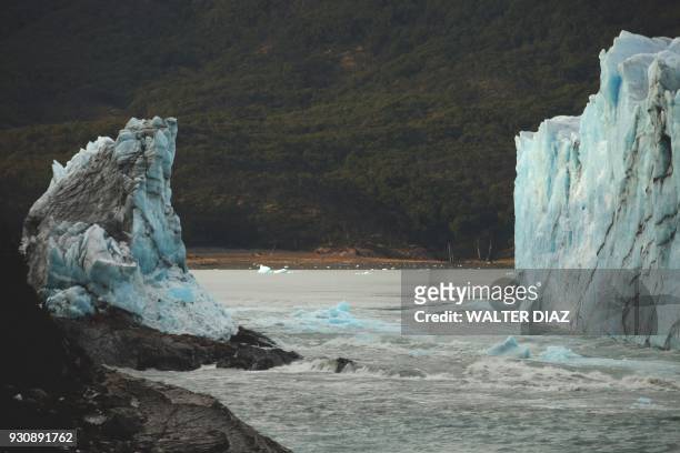 View of the gap left after an arch of ice formed between the Perito Moreno glacier and the shore of Argentino lake collapsed overnight, at Parque...