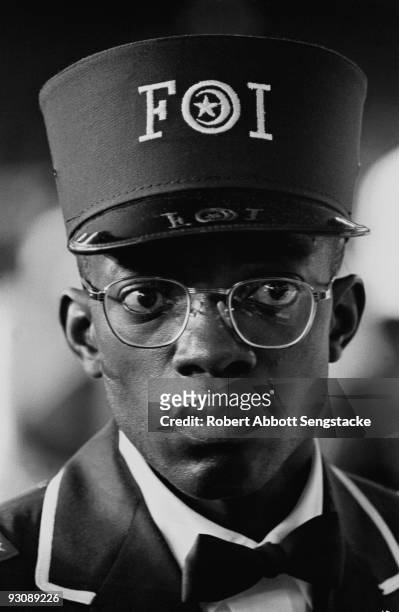 Close-up of a young male Nation of Islam attendee at the Saviour's Day celebrations, Chicago, Illinois, mid 1960s. He wears the uniform of the Fruit...
