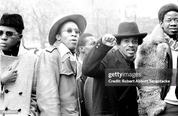 Group of stylisly dressed young men wait outside an unspecified venue to attend the Nation of Islam Saviour's Day celebrations, Chicago, Illinois,...