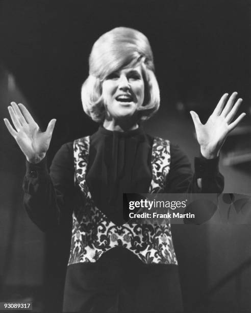 British pop and soul singer Dusty Springfield performs on the television show 'Ready Steady Go!', February 1964.