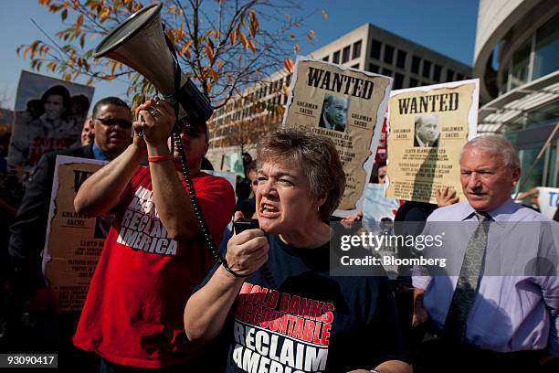 Barbara Kalbach, of the Iowa Citizens for Community Improvement, center, speaks during a union rally outside the offices of Goldman Sachs Group Inc....