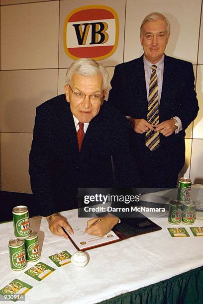 Jim King CEO of CUB, watches as Malcolm Speed CEO of the ACB, signs a new five year sponsorship deal between Carlton and United brand VB and the ACB...