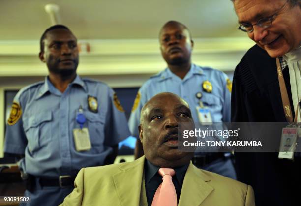 This file picture shows Rwanda's former president Juvenal Habyarimana's brother-in-law, Protais Zigiranyirazo, consulting his counsel on December 18,...