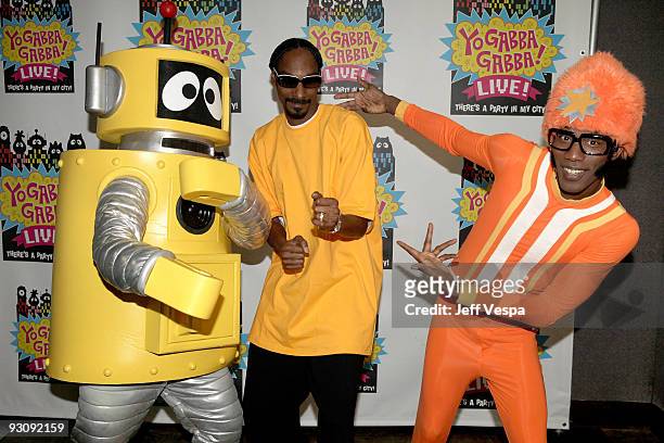 Rapper Snoop Dogg, characters Plex and DJ Lance Rock pose during the Yo Gabba Gabba! : "There's A Party In My City" Live at The Shrine Auditorium on...