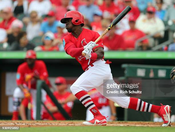 Adolis Garcia of the St. Louis Cardinals in action during a spring training game against the Miami Marlins at Roger Dean Stadium on March 10, 2018 in...