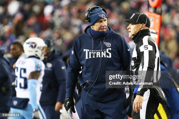 Head coach Mike Mularkey of the Tennessee Titans reacts with the referre in the fourth quarter of the AFC Divisional Playoff game against the New...