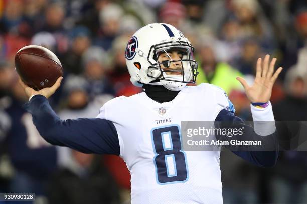 Marcus Mariota of the Tennessee Titans throws in the first quarter of the AFC Divisional Playoff game against the New England Patriots at Gillette...