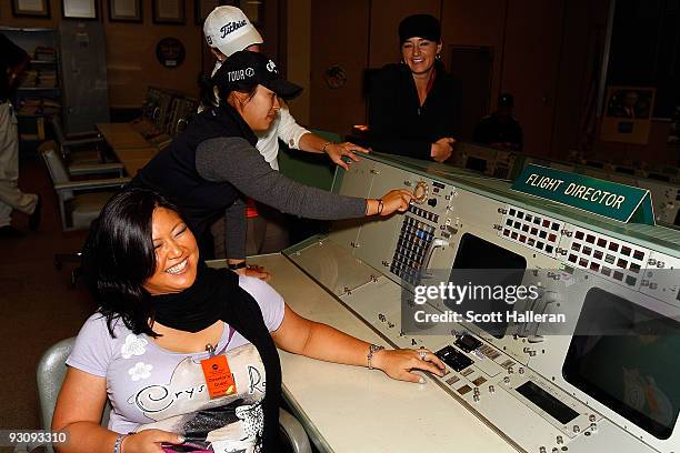 Players, , Christina Kim, Mindy Kim, Leah Wigger and Brandi Jackson pose inside the Apollo control room during a visit to the Johnson Space Center to...